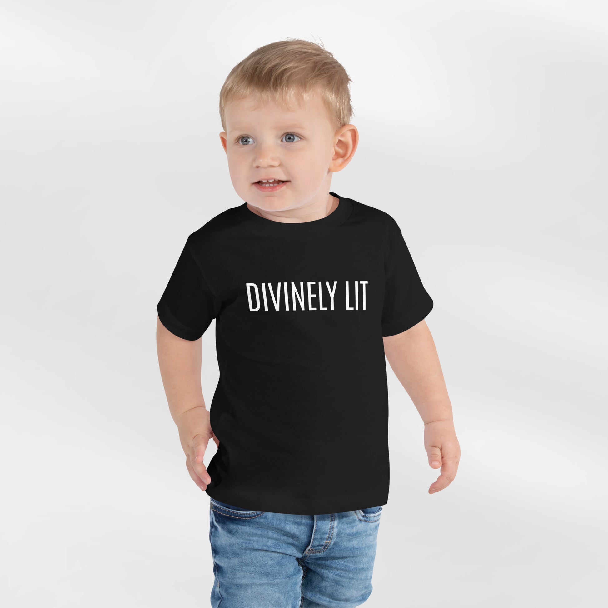 Black Toddler T-shirt with 'DIVINELY LIT' text on a white background