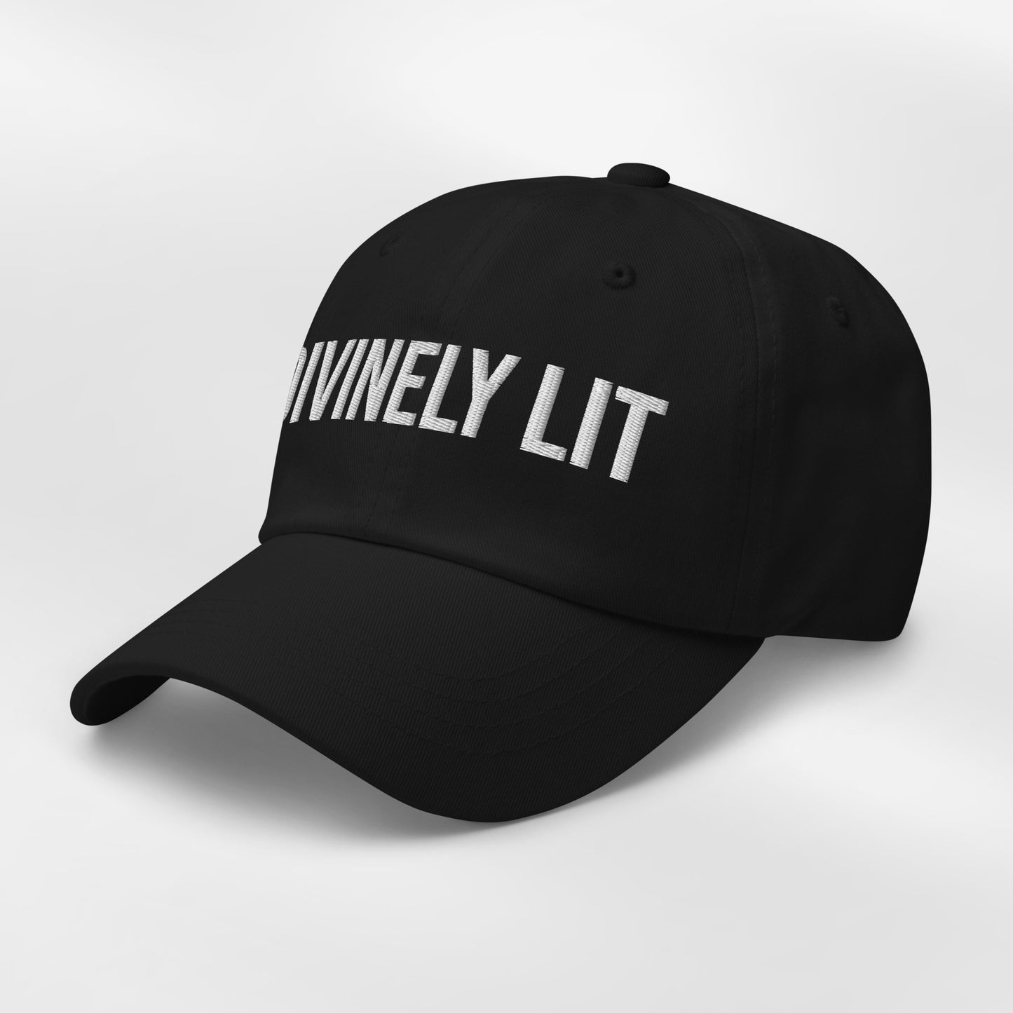 Black cap with embroidered 'DIVINELY LIT' text on a white background