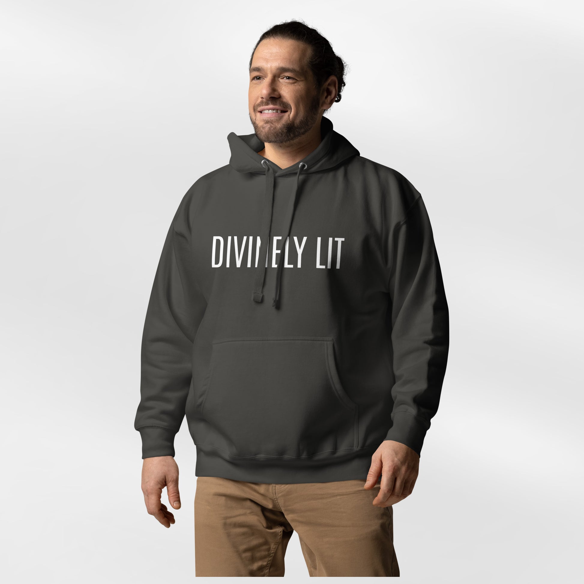 Man wearing a vintage black hoodie with 'DIVINELY LIT' text on a white background